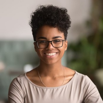 Woman in a glasses is happily smiling